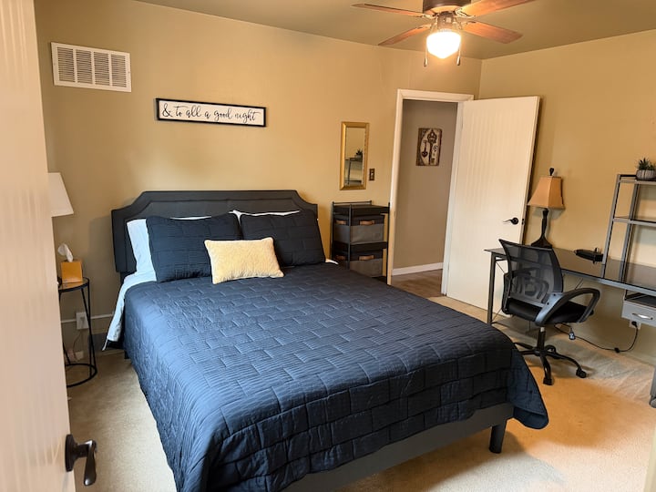Queen bed, work area with desk & chair