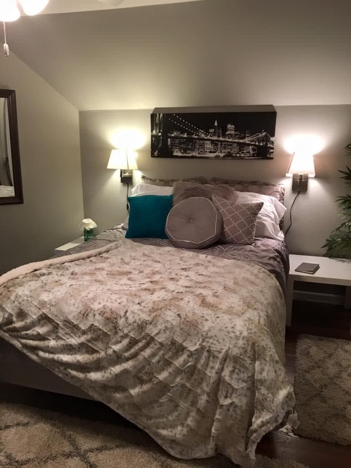 Third bedroom upstairs with queen bed, large tv, and closet 