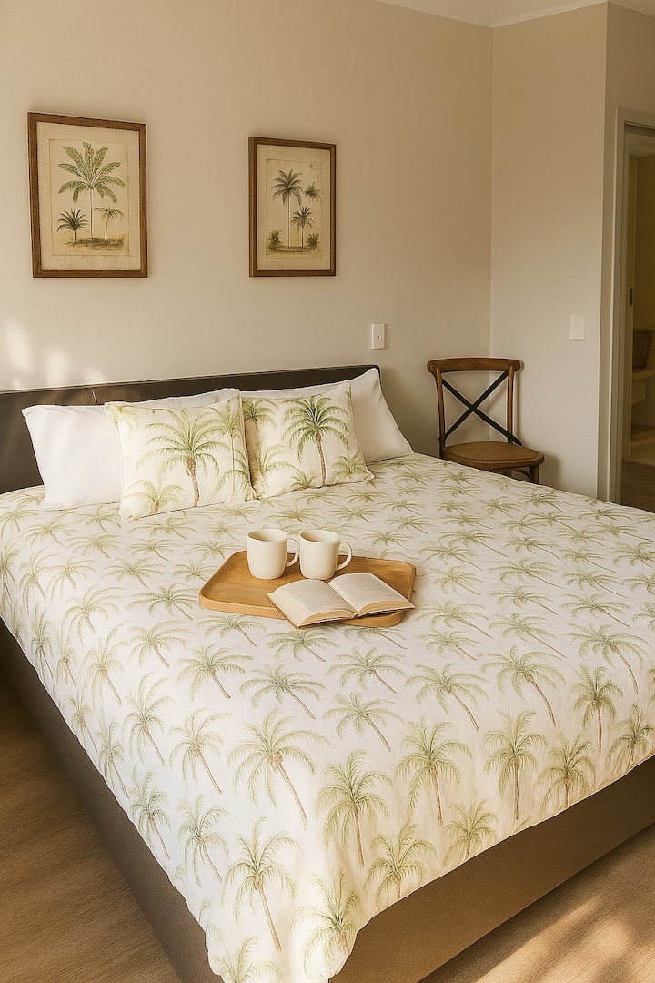 Indulge in your own sanctuary during your holiday with the master bedroom's inviting features, king-sized bed, ensuite bathroom with double sinks, a private patio for relaxation, and views of the lagoon. Unwind and recharge in peace. 