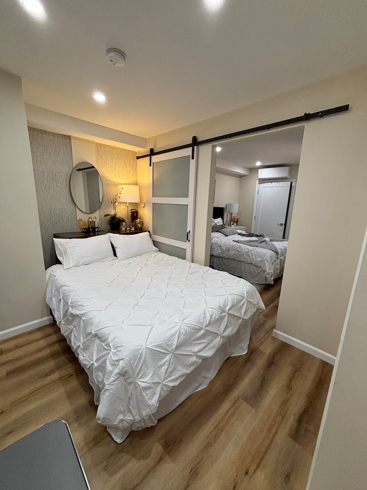 A deluxe air mattress with bedding (just as large and tall as real bed) is available in the bedroom closet and can be placed on the other side of the sliding bedroom barn door in front of the bar as pictured here