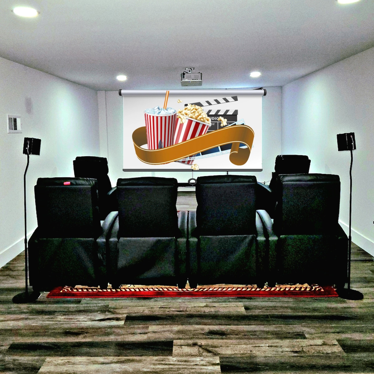 A designated movie theater room features several plush reclining chairs facing a large projection screen. Decorative elements include images of popcorn and film, creating a cinematic environment. Warm lighting enhances the cozy atmosphere, while dark walls and flooring create an immersive viewing experience.