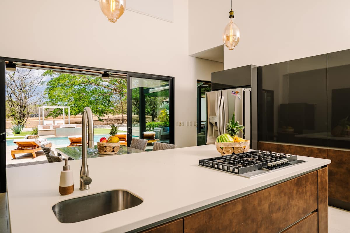 The kitchen island in morning light, fruit bowls out