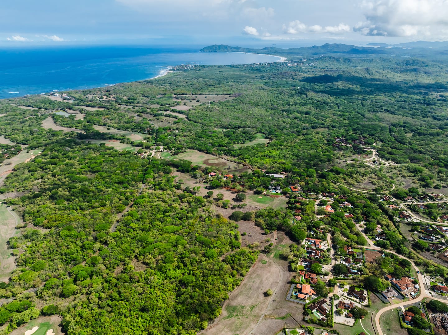 Aerial view of Hacienda Pinilla's forest and coastline