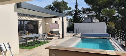 Modern villa with pool in the heart of a pine forest