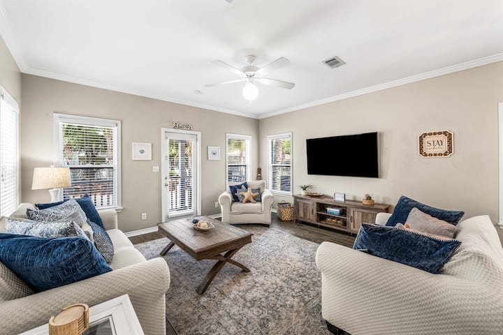 Our living room has seating for 6 (couch, loveseat, & chair) and features a new Samsung 65" Smart TV you can use to stream all your favorite shows.  