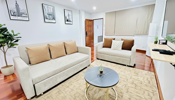 Living Room 2 The comfy sofa beds can sleep up to 3 guests. Enjoy a relaxing night with the 65” smart TV, complete with cable channels