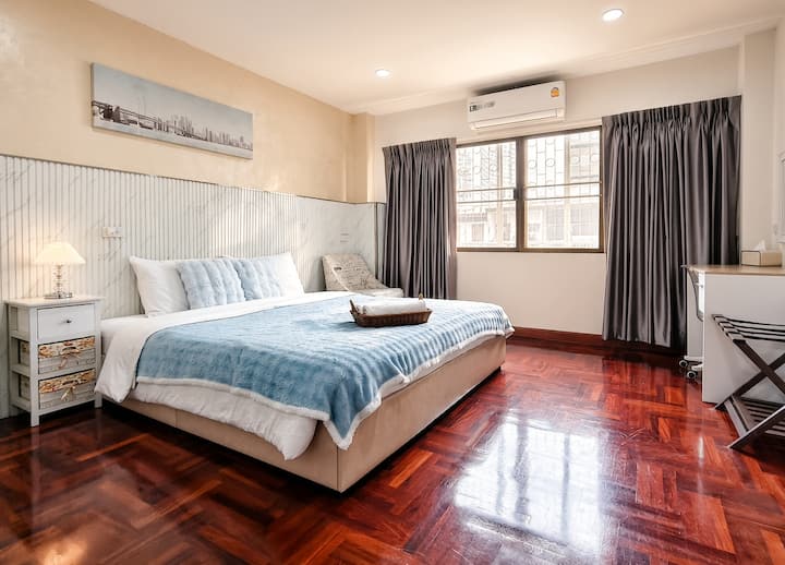 Bedroom 3 — A spacious and cozy room featuring a king bed, a large wardrobe, and a makeup table to get ready with ease.