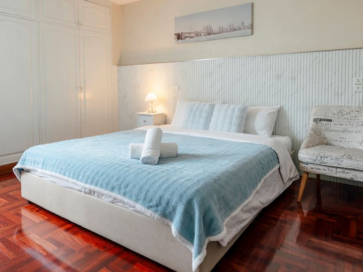 Bedroom 3 — A spacious and cozy room featuring a king bed, a large wardrobe, and a makeup table to get ready with ease.