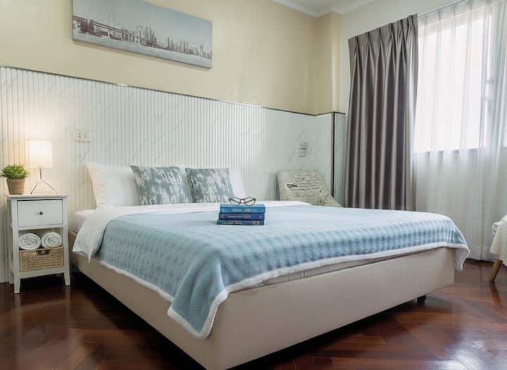 Bedroom 3 — A spacious and cozy room featuring a king bed, a large wardrobe, and a makeup table to get ready with ease. 