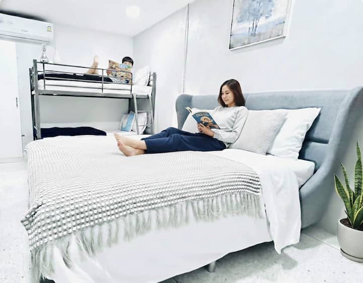 2nd Floor: Bedroom 2 — Features a queen bed, a bunk bed, and a makeup table. 