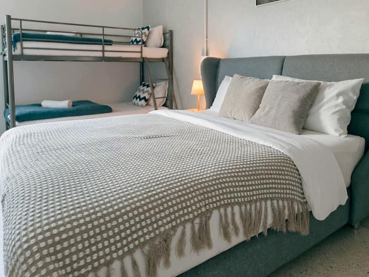 2nd Floor: Bedroom 2 — Features a queen bed, a bunk bed, and a makeup table.