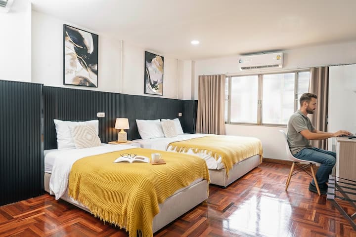 Bedroom 1 — A comfy room with a king bed and a single bed includes a smart TV, working space, and a makeup table! ✨