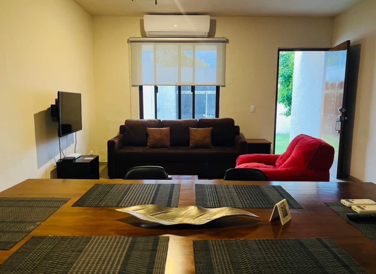 Bright living room with garden view at Villa La Ceiba