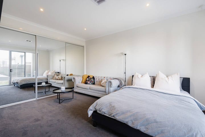 The fifth queen-sized bedroom comes with large wardrobes, a comfortable sofa and own TV for added privacy.