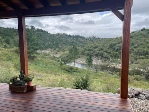 Riverfront house in the mountains