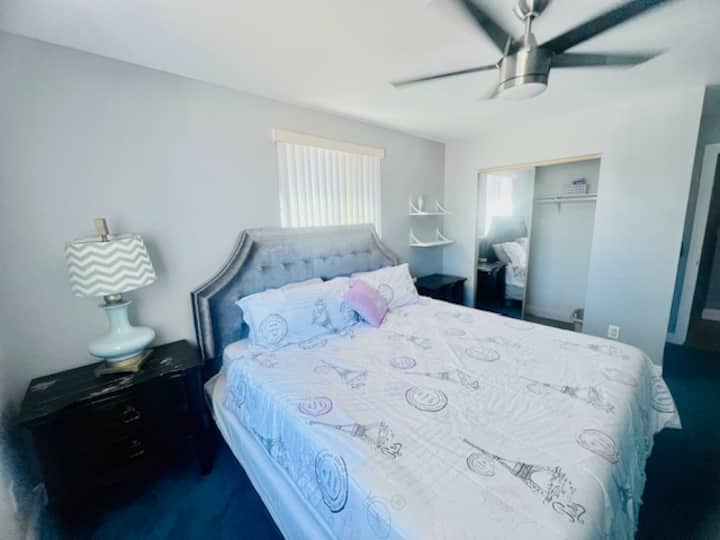 Bedroom #3: King-size bed w/ Memory Foam mattress, Flatscreen TV w/ Fire-stick, Ceiling Fan, Central AC/Heat, Dresser, Nite Stands,  Chair and shared mini fridge, microwave and Keurig coffee maker in the hall by the stairway landing.