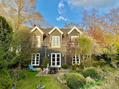 Black wooden house by park