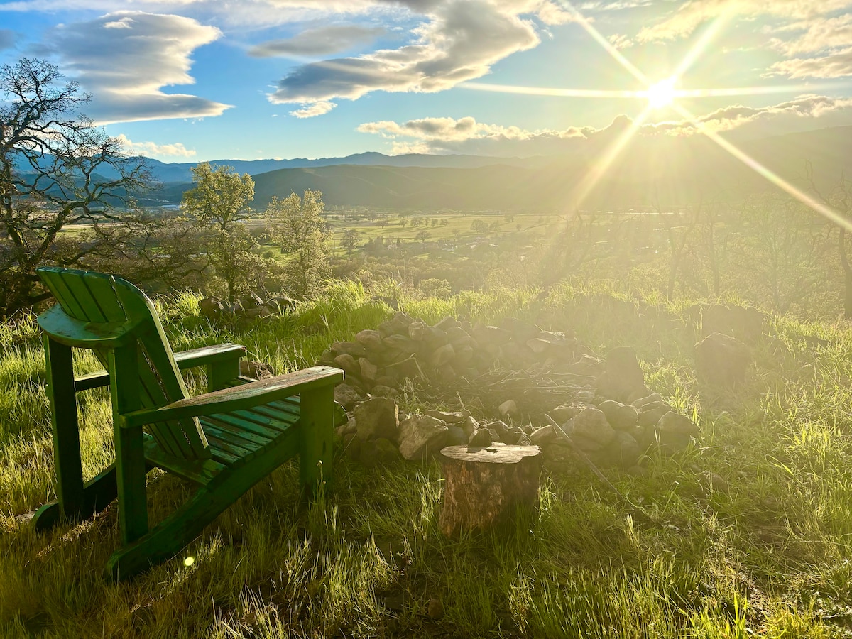 Watching Sunrise and a cup of tea from antique handmade Adirondack chair on your campsite. Real Sunrise! Not Photoshopped or AI! at Stargazing Dome in Hidden Valley Lake