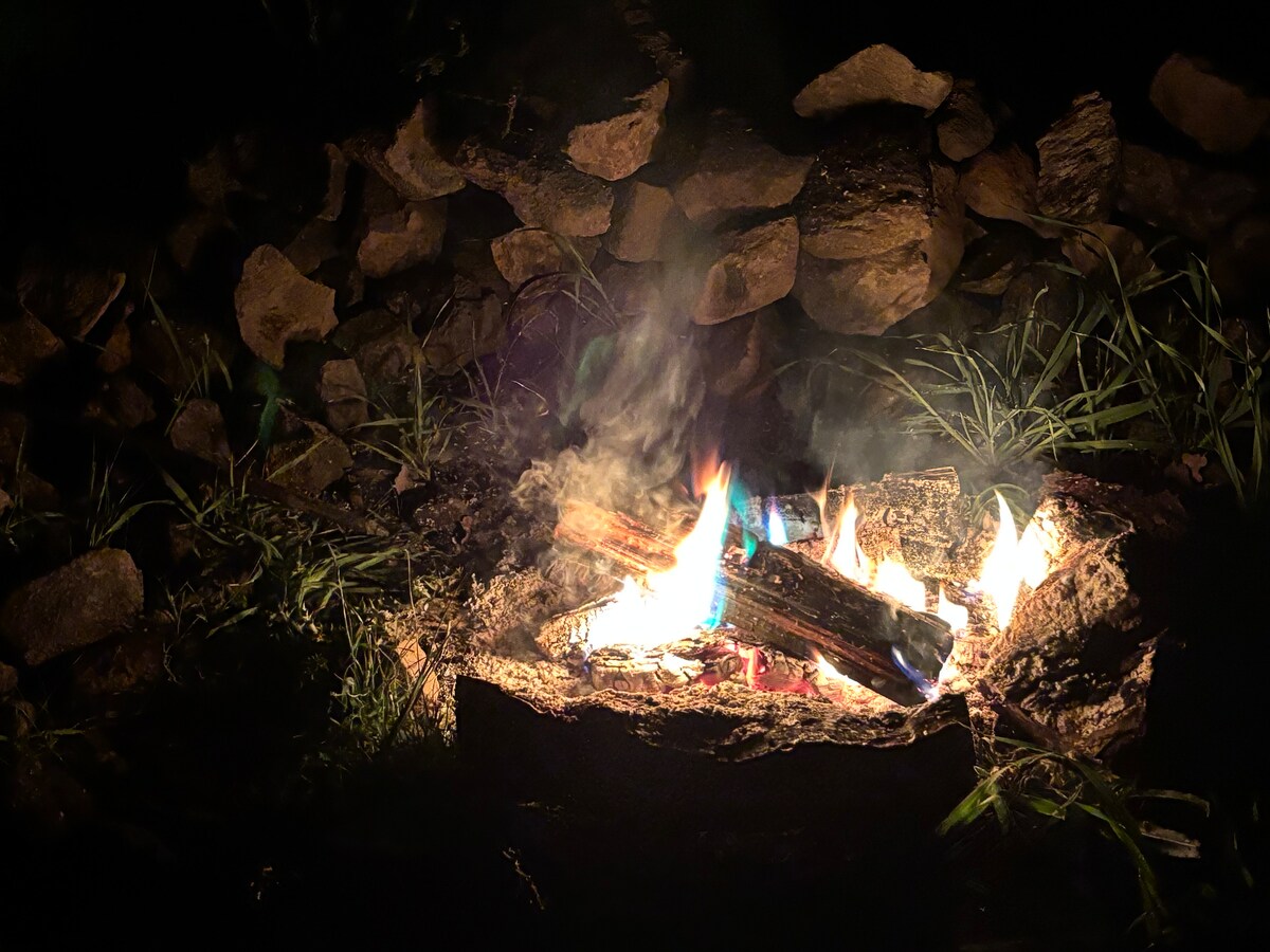 December: The stone firepit at your campsite brings the contrast of primal to the future! Fires are permitted November 1-April 30. at Stargazing Dome in Hidden Valley Lake