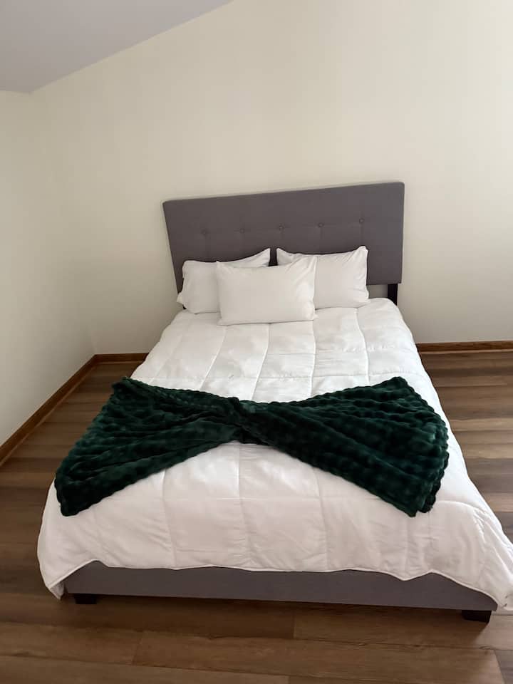 Located in the loft area,

Loft Area Amenities:
	•	Two comfortable queen beds
	•	TV with streaming access
	•	Sitting area with seating for two
	•	Bright, open space with cozy décor
	•	Ideal for relaxing, watching TV, or reading