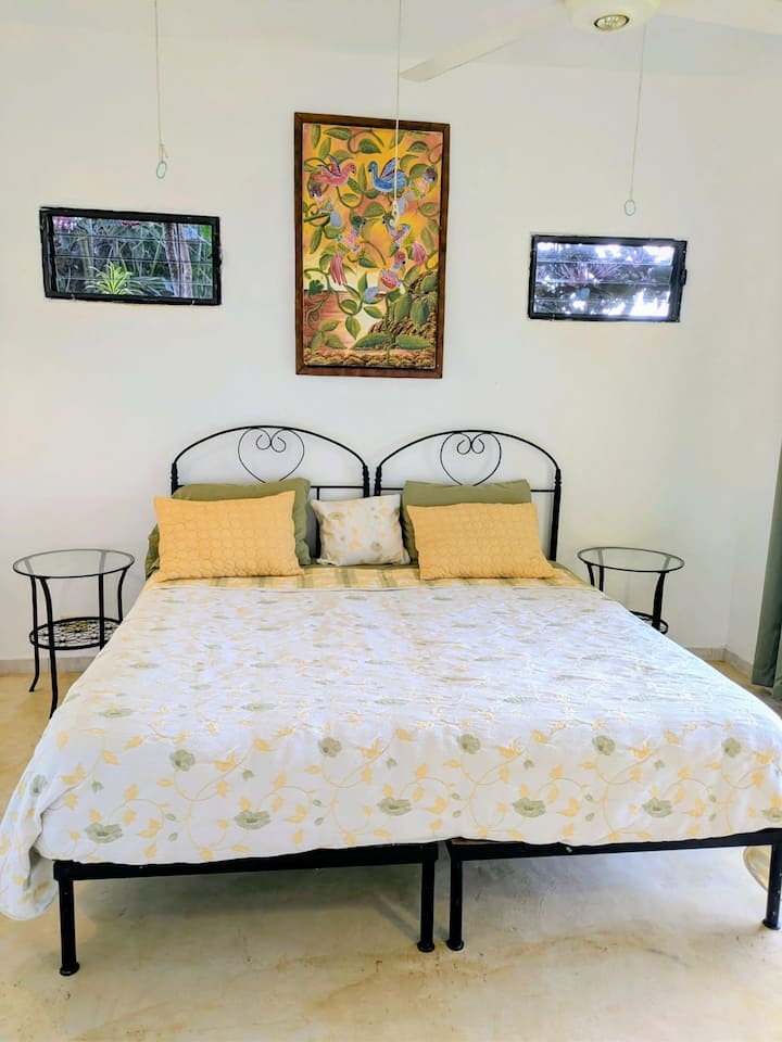 This is a split King Bed. Together it forms a King. Apart it is two single beds. It has a thick pillow topper so you do not feel the crack in the middle.