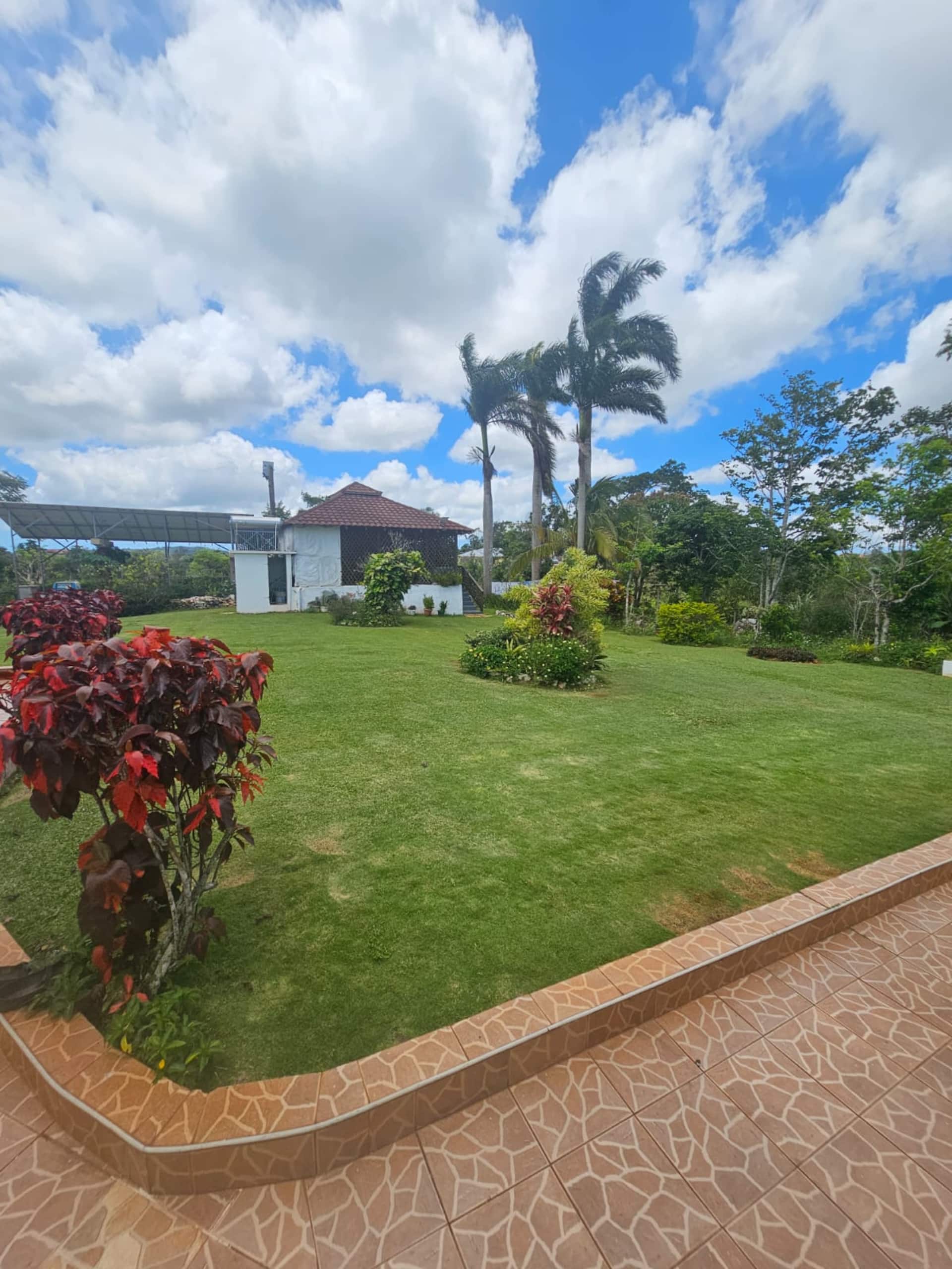 Dalkeith Great House set amid green lawns in the hills of Manchester, Jamaica