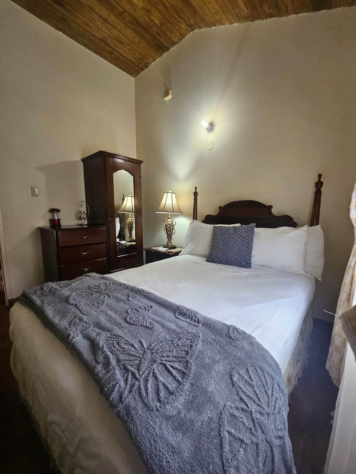 Elegant four-poster bedroom inside a Dalkeith cottage