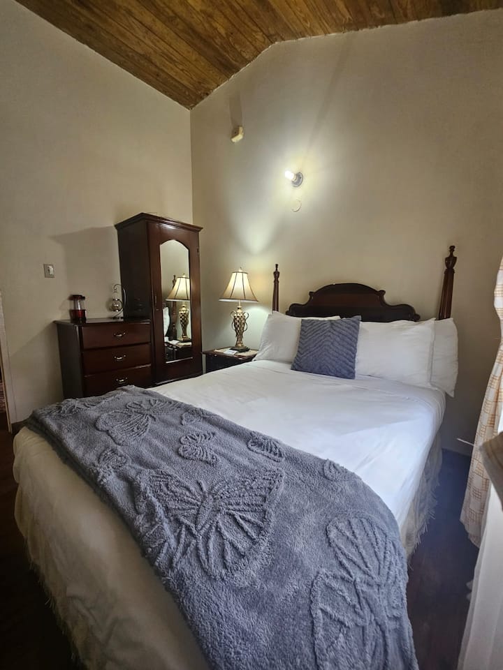 Elegant four-poster bedroom inside a cottage