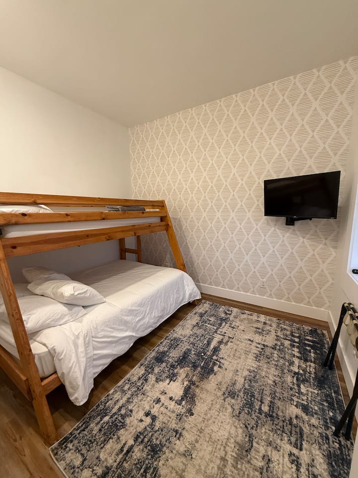 Double over twin bed with Roku TV