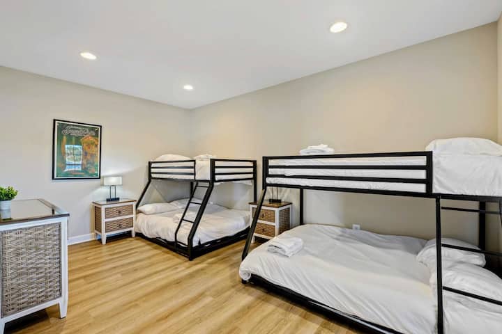 Spacious room with two bunk beds, perfect for a family stay