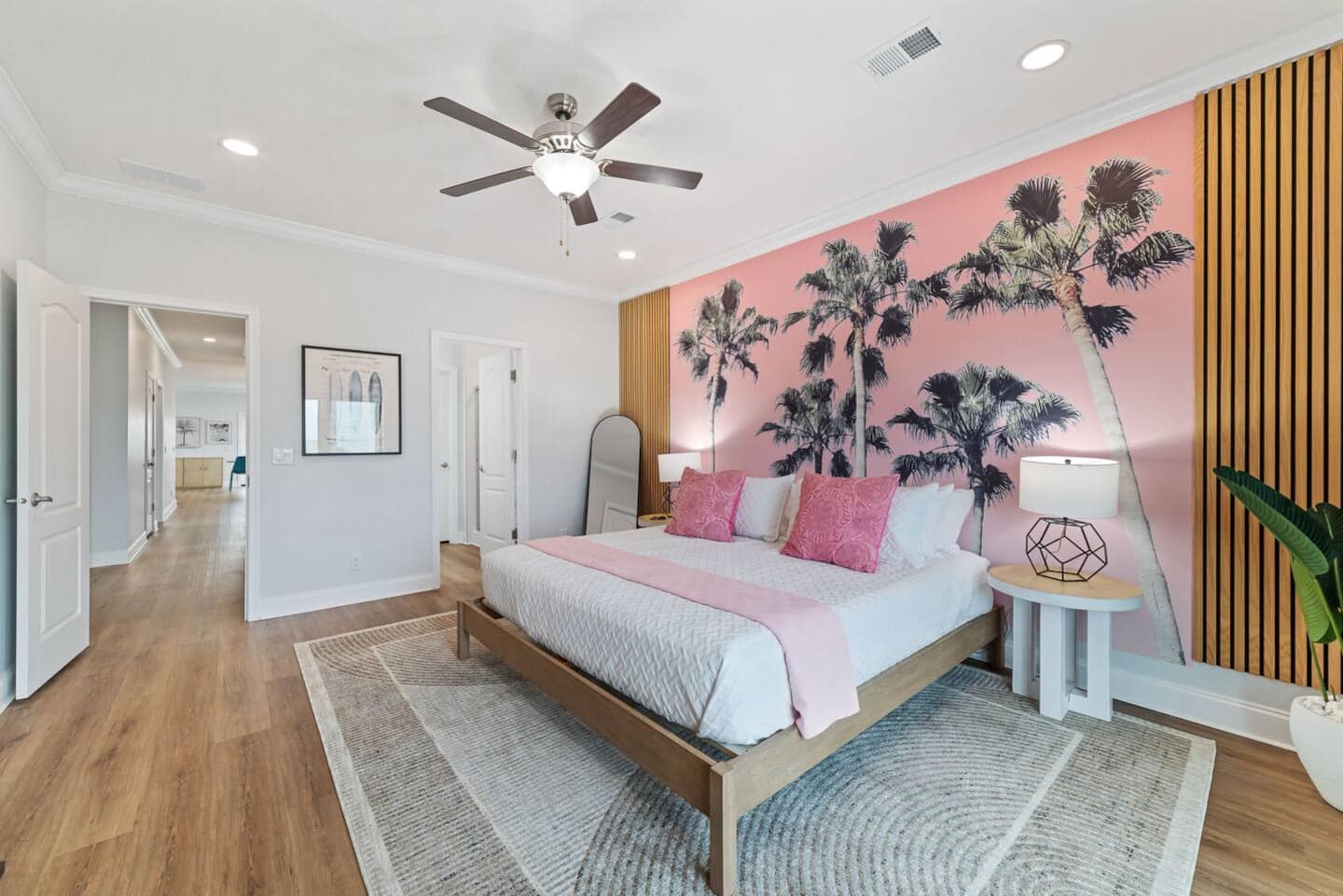 King bed with palm tree mural