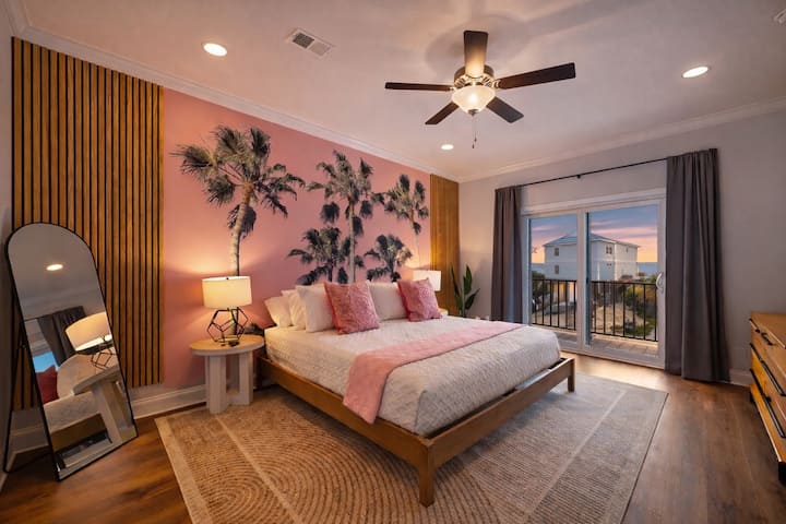Sleep under the palm trees, while still enjoying the luxury comforts of this king sized en suite primary bedroom.