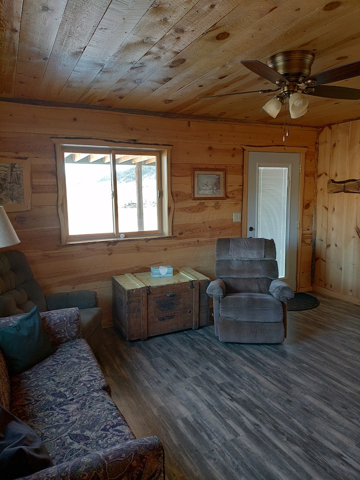 lower living room (ground level)with sofa bed & child's nap nook
