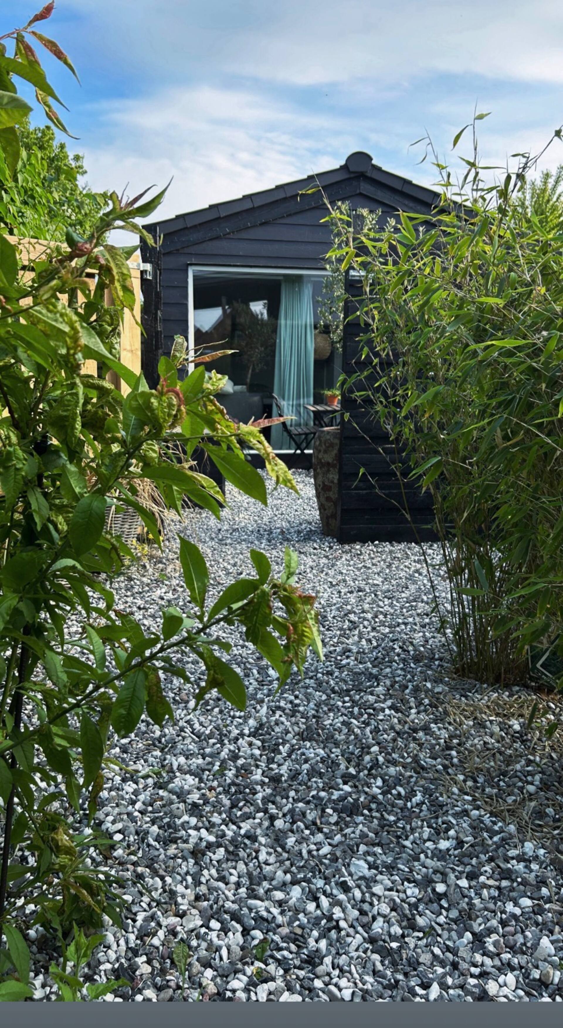 Guest house with courtyard near beach & jetty.