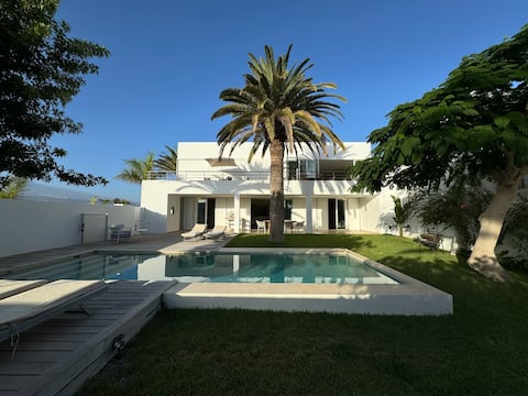 Luxury pool villa with a large garden and sea view