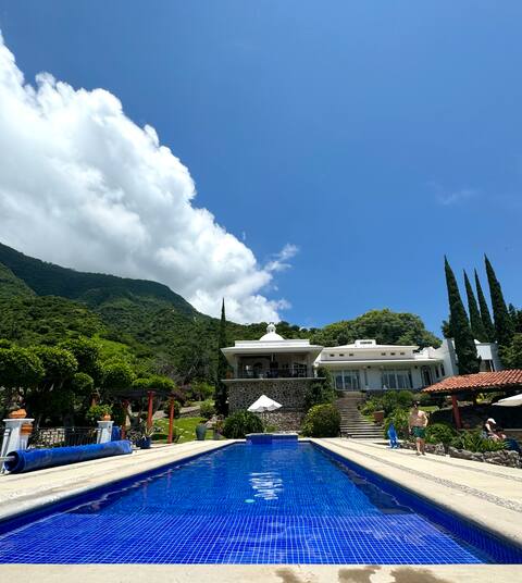 House with a pool and a view of Lake Chapala