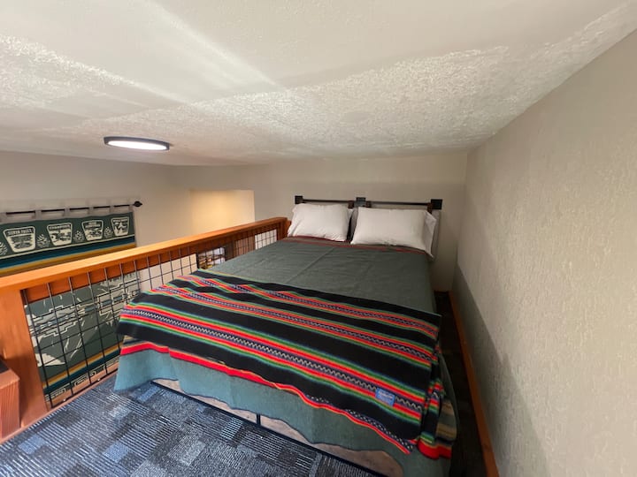 Loft sleeping space with double bed