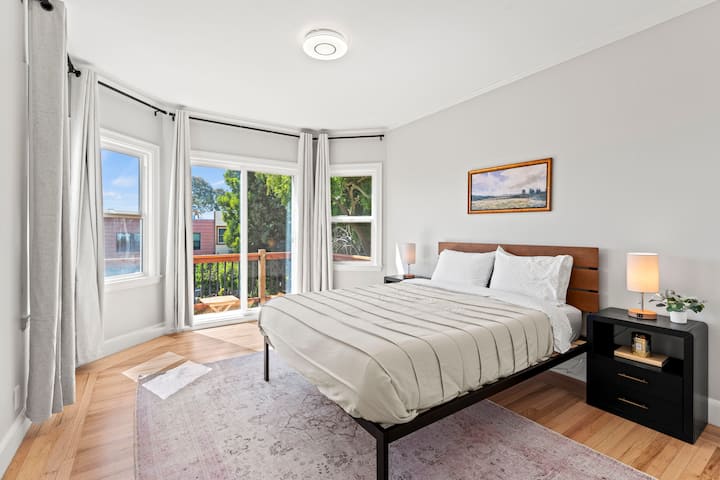 Enjoy the natural light streaming through three windows and sliding glass doors leading to a deck with backyard views. Rest easy with blackout curtains for undisturbed sleep.