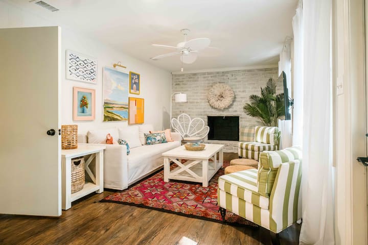 A light and airy living room that is conveniently located directly off the kitchen (sofa easily pulls out to a queen size bed if needed)