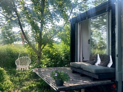 Tiny house with unobstructed views and wood-burning stove