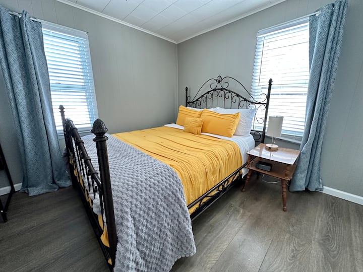 This is the other bedroom on the main floor (primary bedroom is the other). This bedroom features a queen bed, large closet, desk, and Roku smart Tv. 