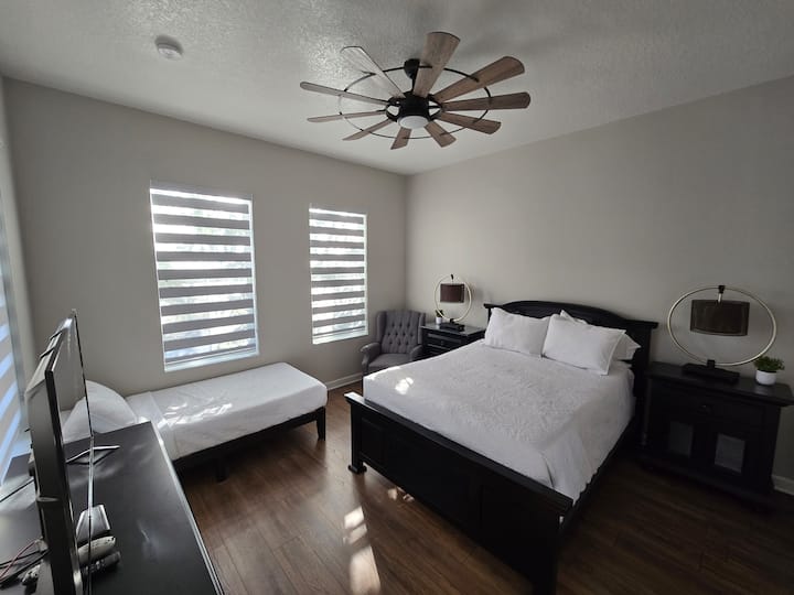 Spacious second floor queen bedroom with 45 inch TV.