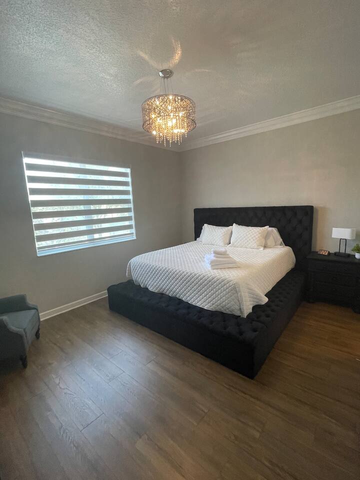 Spacious second floor master bedroom with king bed,  55 inch TV, and private attached master bathroom.