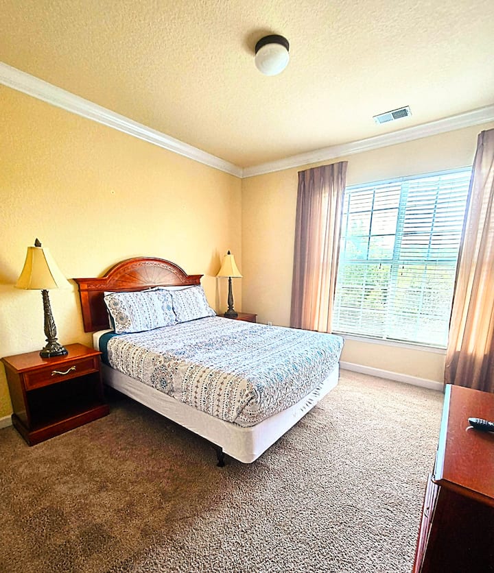 Bedroom with natural view of trees