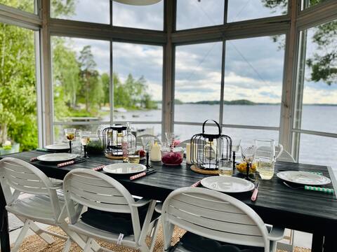 Lakeside cabin with a Private Beach and boat