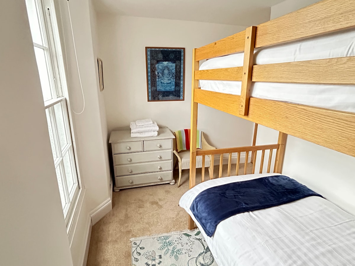 Cosy twin room on the second floor with bunk single beds, chest of drawers and some toys for the kids. Beds full size so will also fit adults and teens. Light and airy with sea views. On the same floor as bathroom and master bedroom.