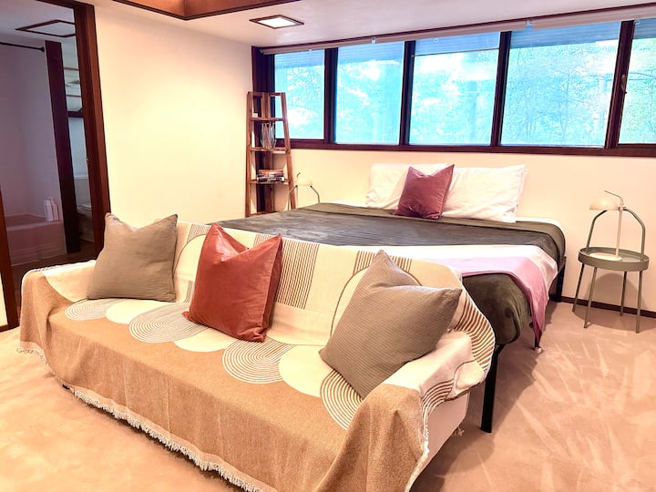 Restful en suite bedroom with a flexible, bedding arrangement. Two twins become a comfortable king with king-size mattress topper. Easily separated to 2 twin beds.
