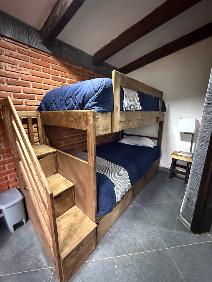 Bedroom with bunk beds, two single beds.
With a warm quilt and an extra quilt if needed.