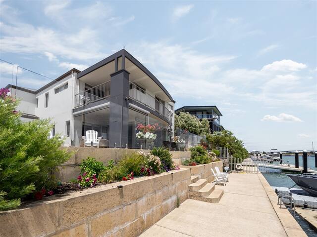 Sunset Waters Absolute waterfront Beach house.