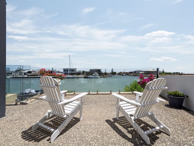 Sunset Waters Absolute waterfront Beach house.